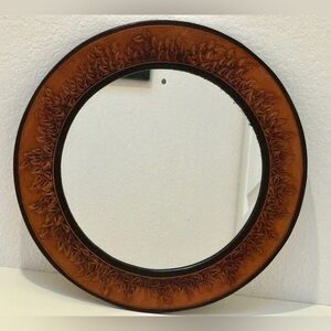 Vintage handmade leather wall mirror.